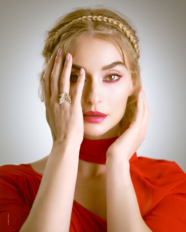 red dress portait hand in front of face